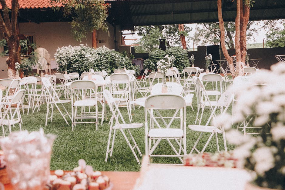 A serene outdoor wedding ceremony in a natural setting surrounded by trees