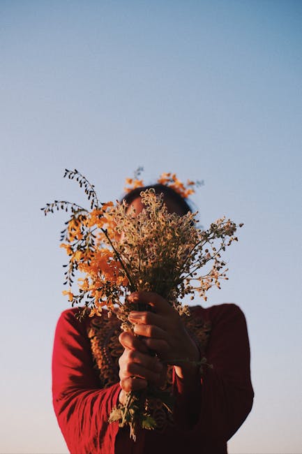 A delicate arrangement of seasonal wildflowers in soft natural tones